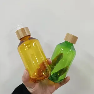 Rỗng màu xanh lá cây màu vàng 200ml 300ml 500ml nhựa PET dầu gội vòi hoa sen gel Lotion bơm chai với nắp tre