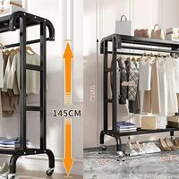 Porte-vêtements à roulettes robuste en métal noir à double barre, avec barres de suspension doubles, roues verrouillables et étagère de rangement inférieure