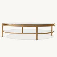 Table basse MARCEAU, choix entre un design carré ou ovale avec plateau en verre transparent et base en métal doré, luxe moderne pour le salon