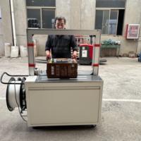 Machine d'emballage électrique automatique pour cartons et articles ronds avec bande PP de 5 mm, prête à être expédiée