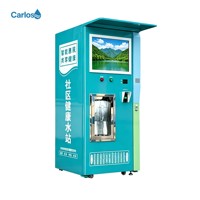 Distributeur d'eau pure Carlos avec plusieurs modes de paiement et écran publicitaire pour la communauté