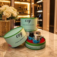 Boîte en carton ronde de luxe avec logo personnalisé, tube en papier cylindrique vert de haute qualité pour l'emballage de flacons de parfum et d'huiles essentielles