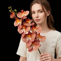 Vente en gros de tiges d'orchidées artificielles en plastique à 9 têtes, effet réaliste, fleurs artificielles pour les décorations florales de mariage, d'hôtel et de table