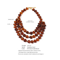 Collier superposé fait main XY 6976 en acier inoxydable et acrylique, avec pendentif cœur, ambre vert et rouge foncé
