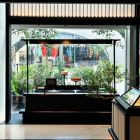 Edgy Luxe Cosmetics Boutique Featuring Tiered Open Shelves, Partial Enclosure Checkout, and Integrated LED Display Shelves