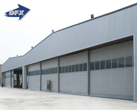 Qingdao Hangar en acier industriel pré-fabriqué Conception de cadre de portail à portée claire Porte coulissante Application d'entrepôt Structure en acier