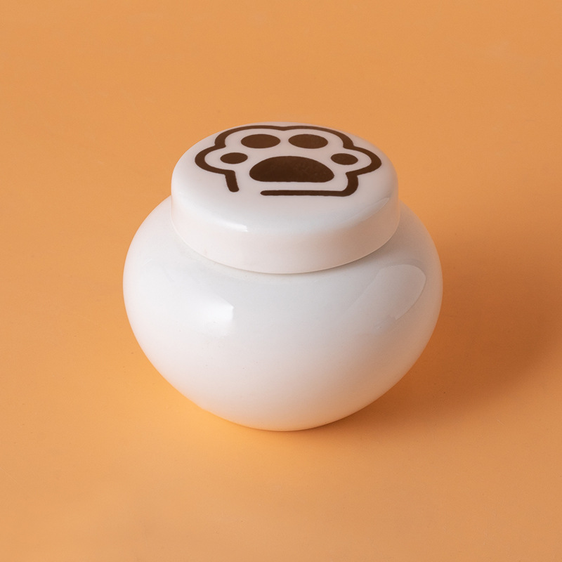 Round ash urn-white-black paw print