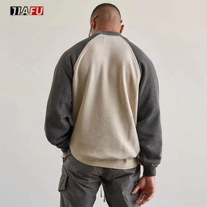 Sudaderas de algodón personalizadas al por mayor para hombre, con bloques de color, cuello redondo, manga raglán, puños y dobladillo acanalados, estilo casual urbano, en grandes cantidades. - Product Image 2