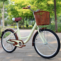 Bicyclette de ville de loisirs au design simple avec siège arrière et panier de rangement