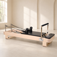 Tmax Reformer de Pilates élégant en bois d'érable massif, équipement de Pilates en gros, rembourrage personnalisé avec logo, certifié CE ISO