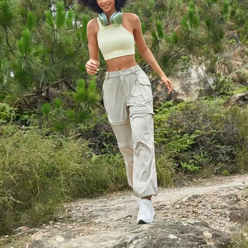 Fornecedor de roupas esportivas femininas com zíper calças cargo com zíper removível de nylon leve à prova d'água para caminhadas ao ar livre