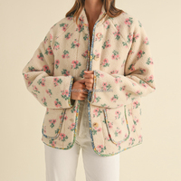 Veste en sherpa à manches longues avec imprimé floral et bordure contrastée