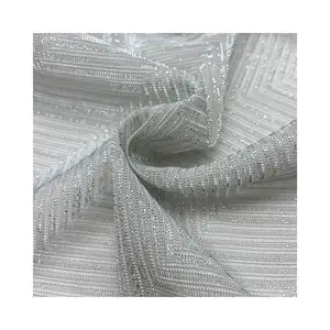 Gros bon design 100% Polyester jacquard tissu Lurex tricoté avec du fil métallique Lurex Jersey tissu métallique pour les femmes Dre