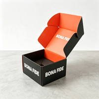Boîte d'expédition personnalisée avec logo, intérieur noir et orange, en carton ondulé, pour les entreprises de vente en ligne de vêtements et de produits de beauté
