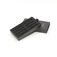 Boîte rigide noire personnalisée à couvercle coulissant avec ruban de traction et logo en feuille d'or pour l'emballage de produits haut de gamme