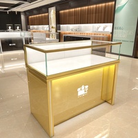 Mostrador de tienda minorista de oro de lujo, mesa de exhibición de diseño, joyería, muebles, escaparates de joyería de cristal, luces Led