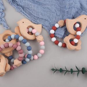 Nouveau design <span class=keywords><strong>anneau</strong></span> en <span class=keywords><strong>bois</strong></span> de hêtre jouet de <span class=keywords><strong>dentition</strong></span> pour bébé perles en silicone de qualité alimentaire sans BPA jouet de <span class=keywords><strong>dentition</strong></span> à mâcher pour bébé conception d'<span class=keywords><strong>oiseau</strong></span> jouet molaire pour bébé - Product Image 4