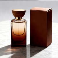Prix d'usine – Flacon de parfum vide en verre transparent personnalisé pour homme, 50 ml/100 ml, avec pompe pulvérisatrice, boîte de luxe carrée, bouchon doré, sérigraphie