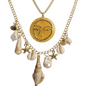 Collar Bohemio Chapado en Oro con Cuentas de Vidrio, Colgante de Rostro y Dijes de Estrella de Mar, Joyería Artesanal Unisex para Fiesta - Product Image 1
