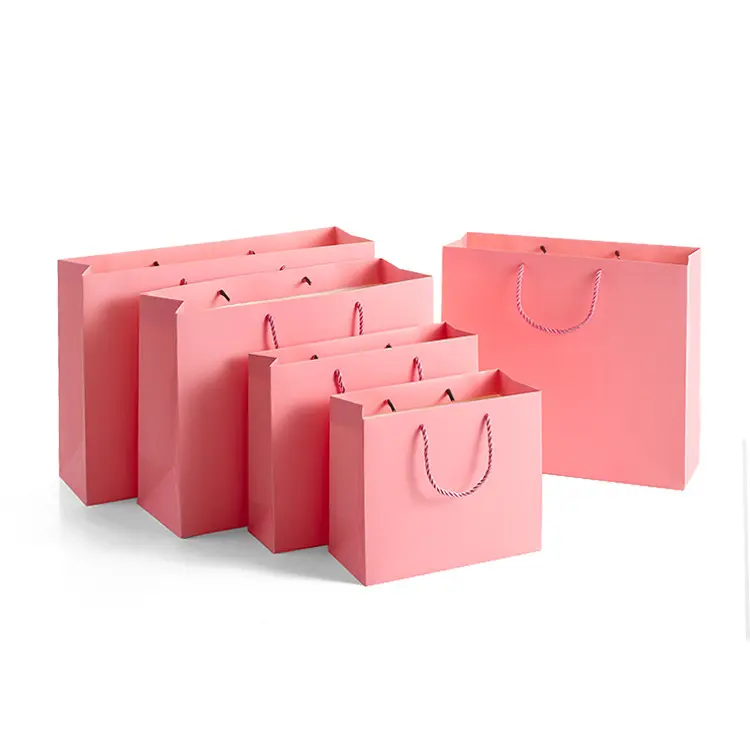 Grandi quantità in magazzino Logo stampato confezione natalizia regalo sacchetto di carta rosa per negozio di abbigliamento