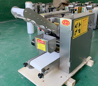 Machine à raviolis commerciale automatique 220V pour la formation de boulettes Moteur de peau de ravioli de viande chinoise inclus pour un usage domestique