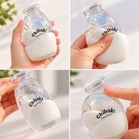 Vente en gros : Jouet anti-stress souple et transparent en forme de bouteille de lait, à remontée lente, jouet sensoriel à presser, cadeau personnalisé OEM
