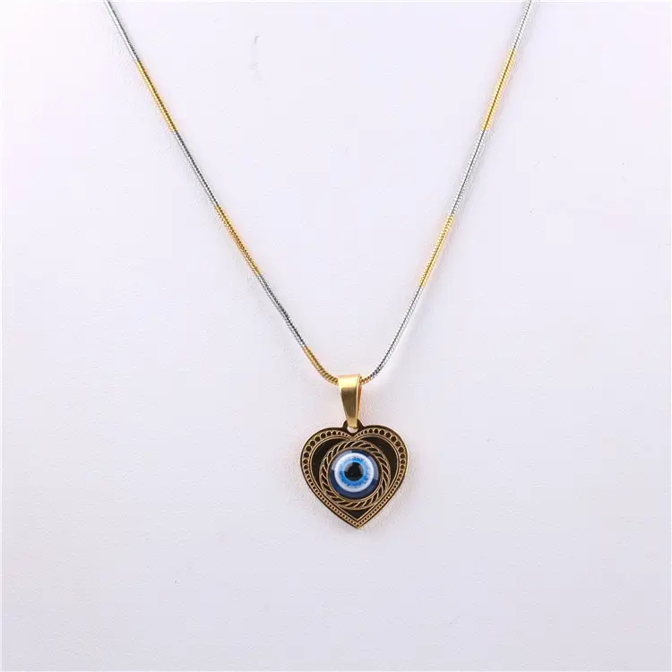 Vente en gros de chaînes tendances en acier inoxydable plaqué or 18 ct colliers pendentifs fantaisie en forme de cœur avec motif d'oeil