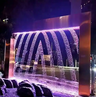 Fuente de Cascada Moderna de Acero Inoxidable Optimum Show con Luces LED Multicolores y 2 Años de Garantía para Jardines y Restaurantes al Aire Libre