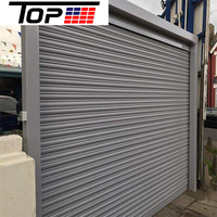 Porte de garage isolée à enroulement avec système de verrouillage anti-vent pour bâtiments de grande hauteur
