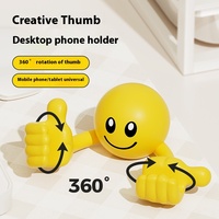 Dessin animé d'usine original pour visage souriant pouces rotatifs ornements de bureau en plastique pour téléphones mobiles/supports de tablette