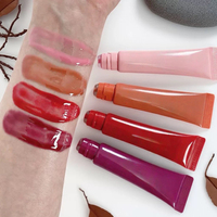 Vente en gros Tubes à presser végétaliens rose brillant à lèvres maquillage beignet brillant à lèvres logo personnalisé marque privée arôme huile Peptide brillant à lèvres