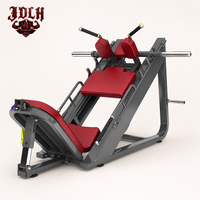 Máquina de prensa de piernas comercial de doble dirección con soportes acolchados y carga de discos de peso para entrenamiento de cuádriceps y glúteos