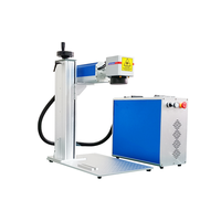 Machine de marquage laser à fibre 10W pour l'élimination de la peinture sur les boutons transparents en plastique