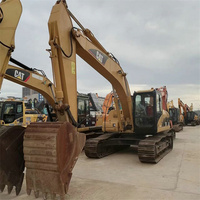 Excavatrice Caterpillar Cat 320C d'occasion avec peinture d'origine, prix abordable, pour travaux routiers