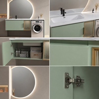 Meuble-lavabo moderne vert sauge avec lavabo, miroir LED rond mural, armoire de buanderie et espace pour machine à laver, idéal pour projets hôteliers