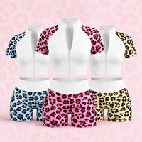 Ensemble de yoga color block imprimé léopard respirant sans couture avec haut court zippé à manches courtes et short push-up personnalisé pour femme
