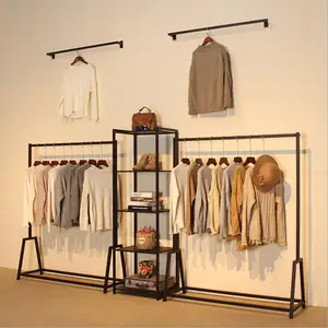 Estante de exhibición de ropa, estante montado en la pared de Boutique negra, diseño de Interior de tienda de ropa al por menor