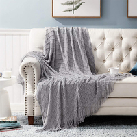 Vente en gros de couvertures décoratives en tricot à franges 100% acrylique texturé uni pour la maison, chaise, canapé, lit