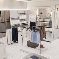 Étagères suspendues en métal personnalisées tendance pour vêtements féminins, présentoir de vêtements sur mesure avec design intérieur pour magasin de vêtements