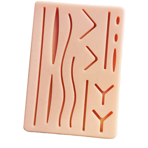Almohadilla de silicona para sutura de heridas con 14 cortes, modelo de entrenamiento de sutura quirúrgica, modelo de piel humana traumática con cortes predefinidos - Product Image 1