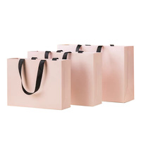 Bolsa de papel logotipo impreso personalizado ropa de lujo bolsas de papel de compras Boutique bolsa de papel de regalo reciclable con cuerda de cinta