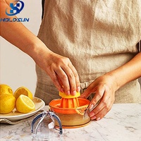 Presse-agrumes manuel portable de couleur personnalisée Presse-agrumes orange citron-lime nouveauté pour la maison fruits et légumes