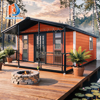 Maison conteneur pliable extensible au design tendance, isolée et résistante au vent, préfabriquée et mobile, avec terrasse et toit-terrasse pour complexe hôtelier
