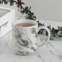 2025 nouvelle tasse en céramique marbre Design personnalisé tasse en porcelaine tasses 11oz blanc noir tasse à café en céramique pour un usage quotidien