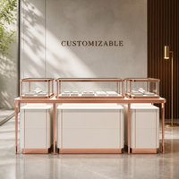 Ensemble de table de présentation de bijoux moderne et luxueux blanc et or rose, vitrine élégante en verre trempé pour les boutiques de détail