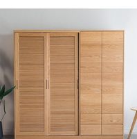 Armoire de chambre moderne en panneaux de particules avec portes battantes à persiennes, durable et écologique, pour villa et salon domestique