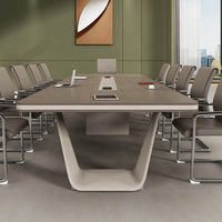 Bureau de salle de réunion d'entreprise avec plateau arrondi, module de câblage encastré et options de couleurs flexibles