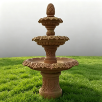 Fontaine de jardin en marbre rouge coucher de soleil à trois niveaux, sculptée à la main, pour la décoration paysagère des cours de villas
