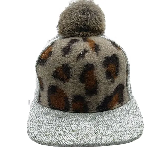 Gray autumn and winter ladies hats with a small fur ball on top