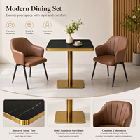Ensemble table et fauteuils, surface en pierre frittée noire avec base en piédestal doré, mobilier pour café, terrasse et véranda